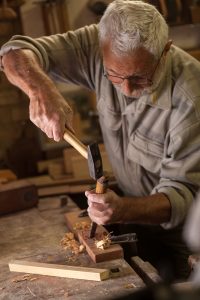 experienced-carpenter-working-in-his-workshop-2025-03-10-11-41-05-utc